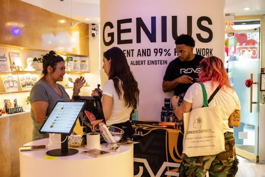 Green Genius dispensary staff serving customers cannabis retail